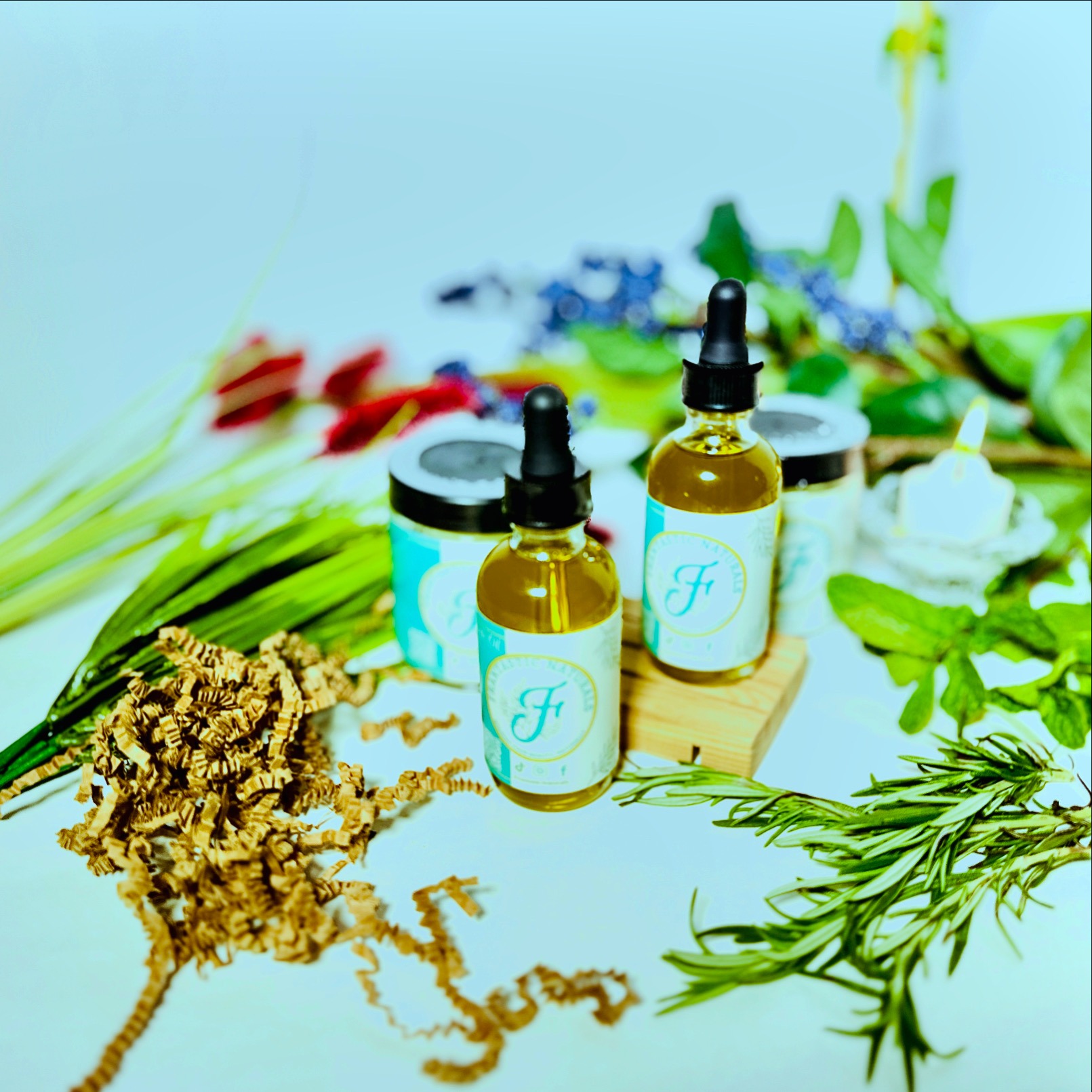 Frantastic Naturals products styled with fresh herbs and botanicals